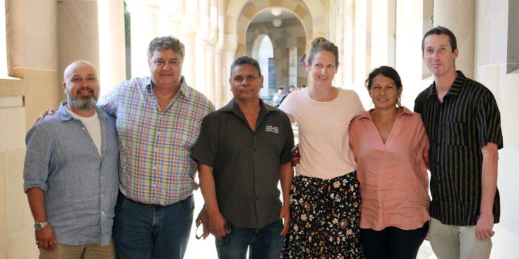 A group of researchers stand together.