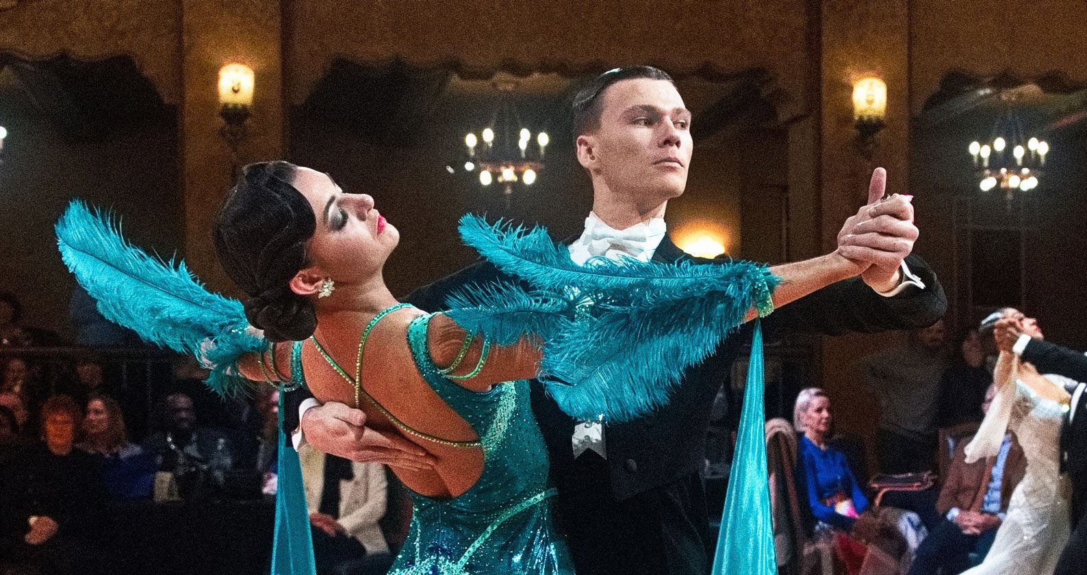 A student and her partner dancing.