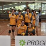 Student from UniLodge posing with medals.