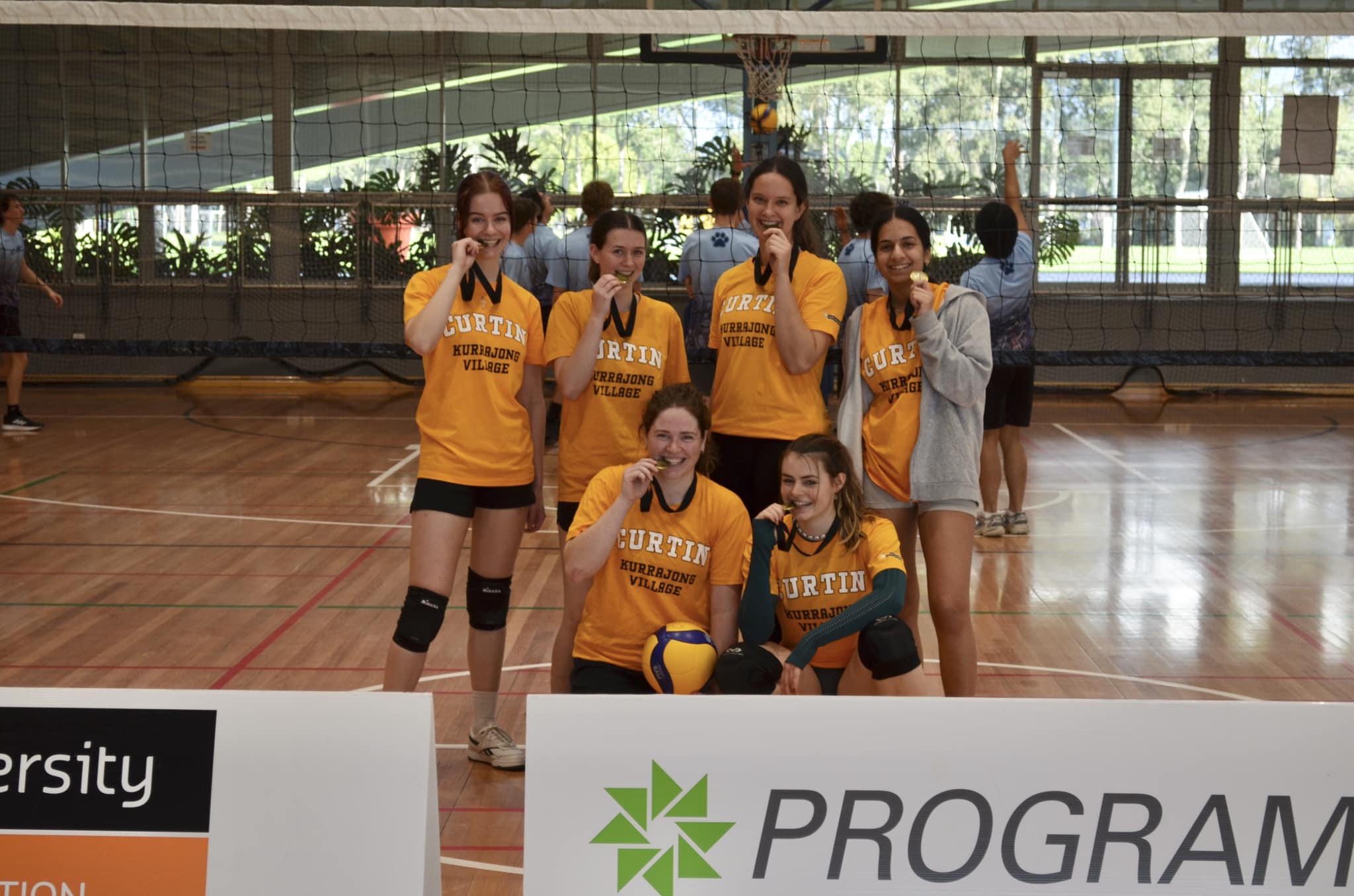 Student from UniLodge posing with medals.