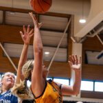Carnabys basketball players scramble for the ball.