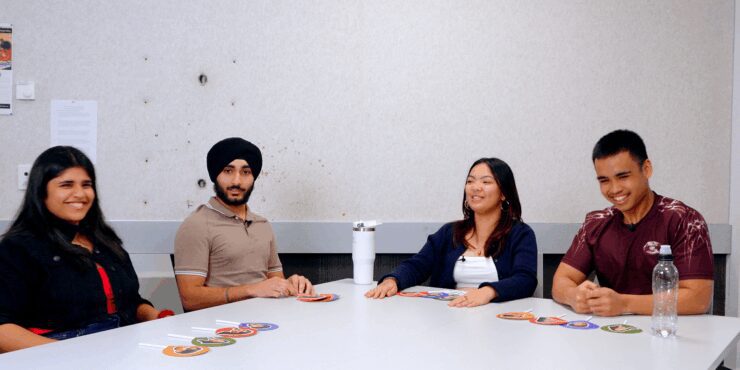 image of Ravish, Aakanksha, Kristel and Musa sitting by the table