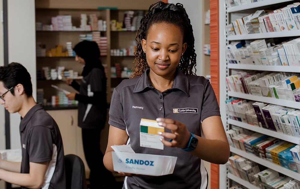 Pharmacy student practices uses a dispensary
