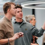 Two students giving feedback in the Curtin Library.