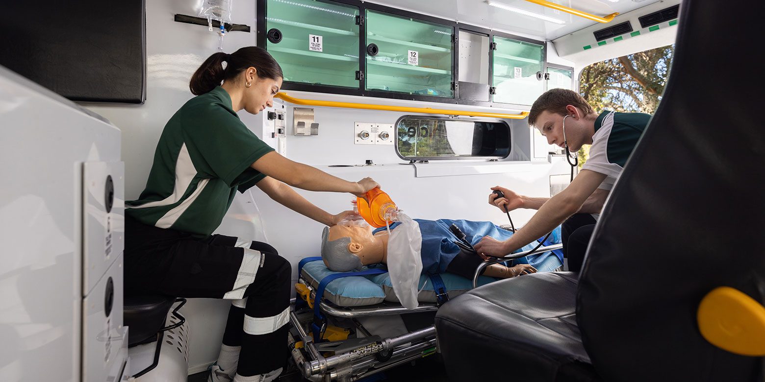 Two Curtin paramedic students working in the 'simbulance'