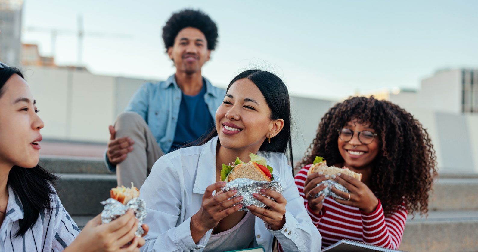Friends sharing laughs over lunch.