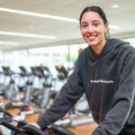 Student on an exercise bike.