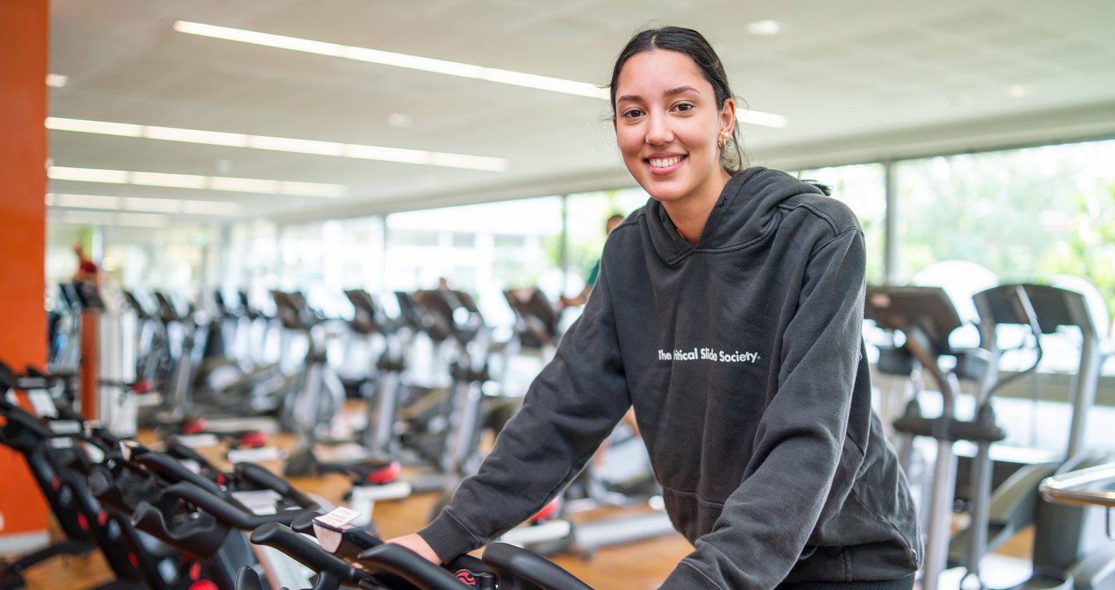 Student on an exercise bike.