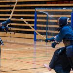 Two students fencing.