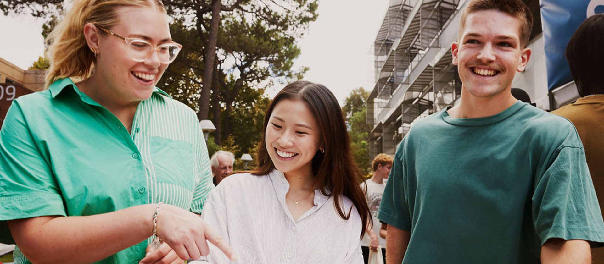 three students walking next to each other