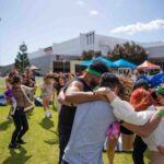 Group of students hugging at Curtin Carnival