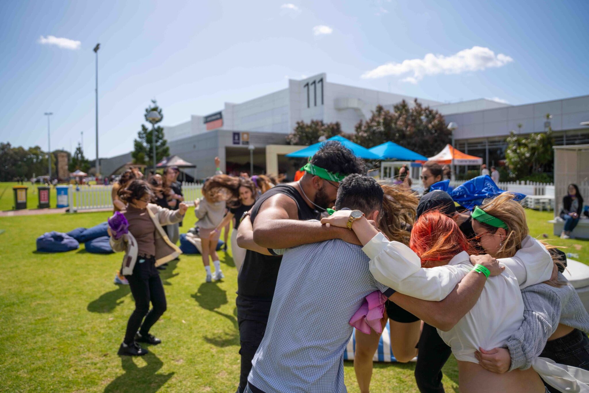 Group of students hugging at Curtin Carnival