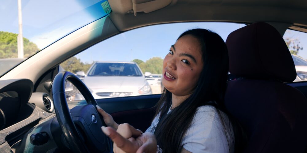 Kristel driving in her car