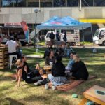 Image of people on a picnic rug at Pop Up Picnic