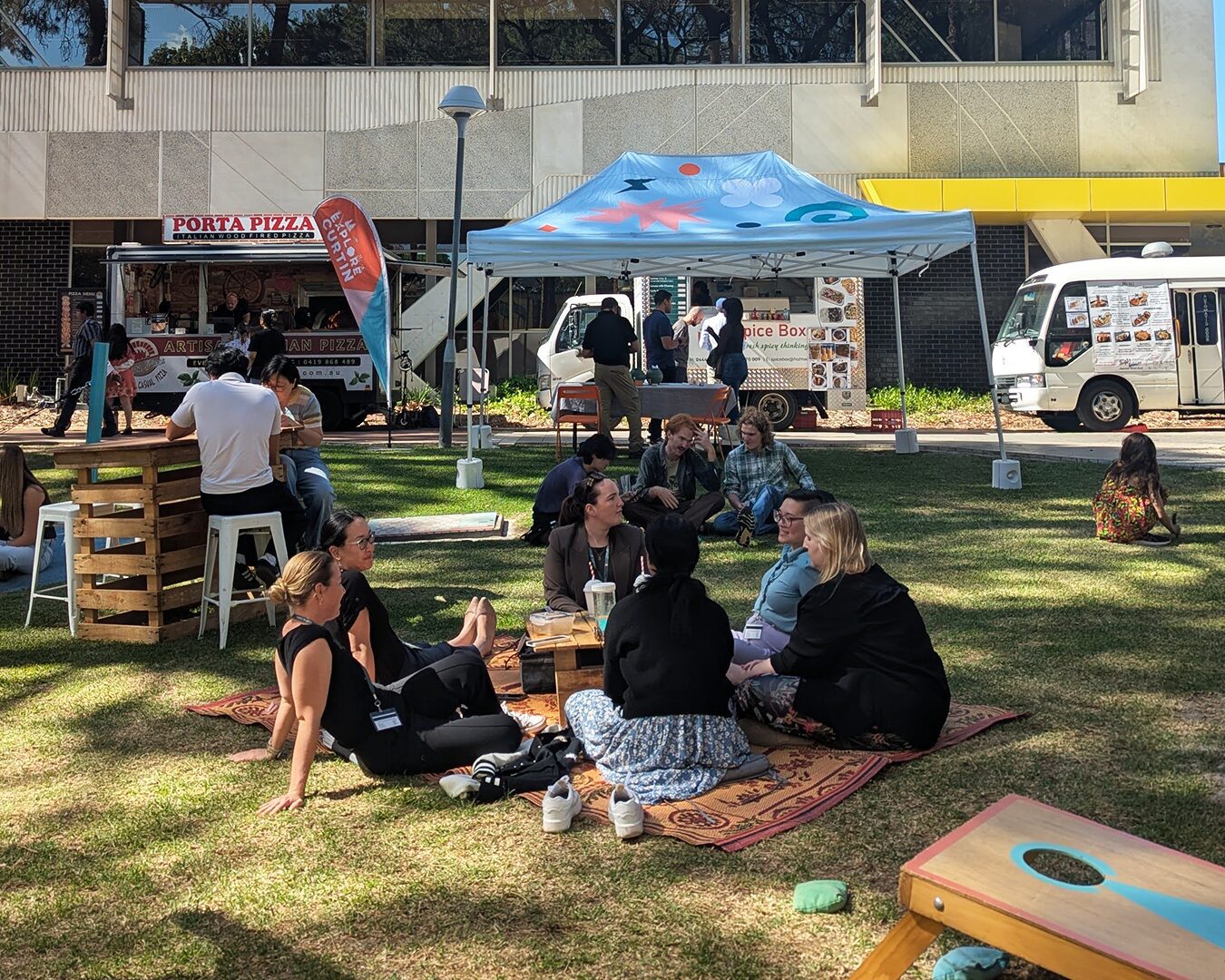 Image of people on a picnic rug at Pop Up Picnic
