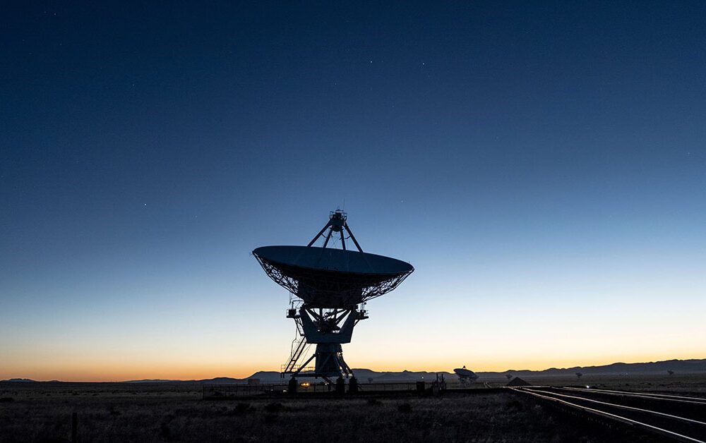 A satellite against sunrise.