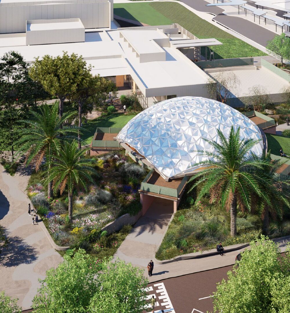The Curtin Dome reimagined as an open‑air pavilion with landscaped greenery and people relaxing on a grassy slope.