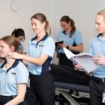 Physiotherapy students providing supervised treatment to a patient in a Curtin clinic.