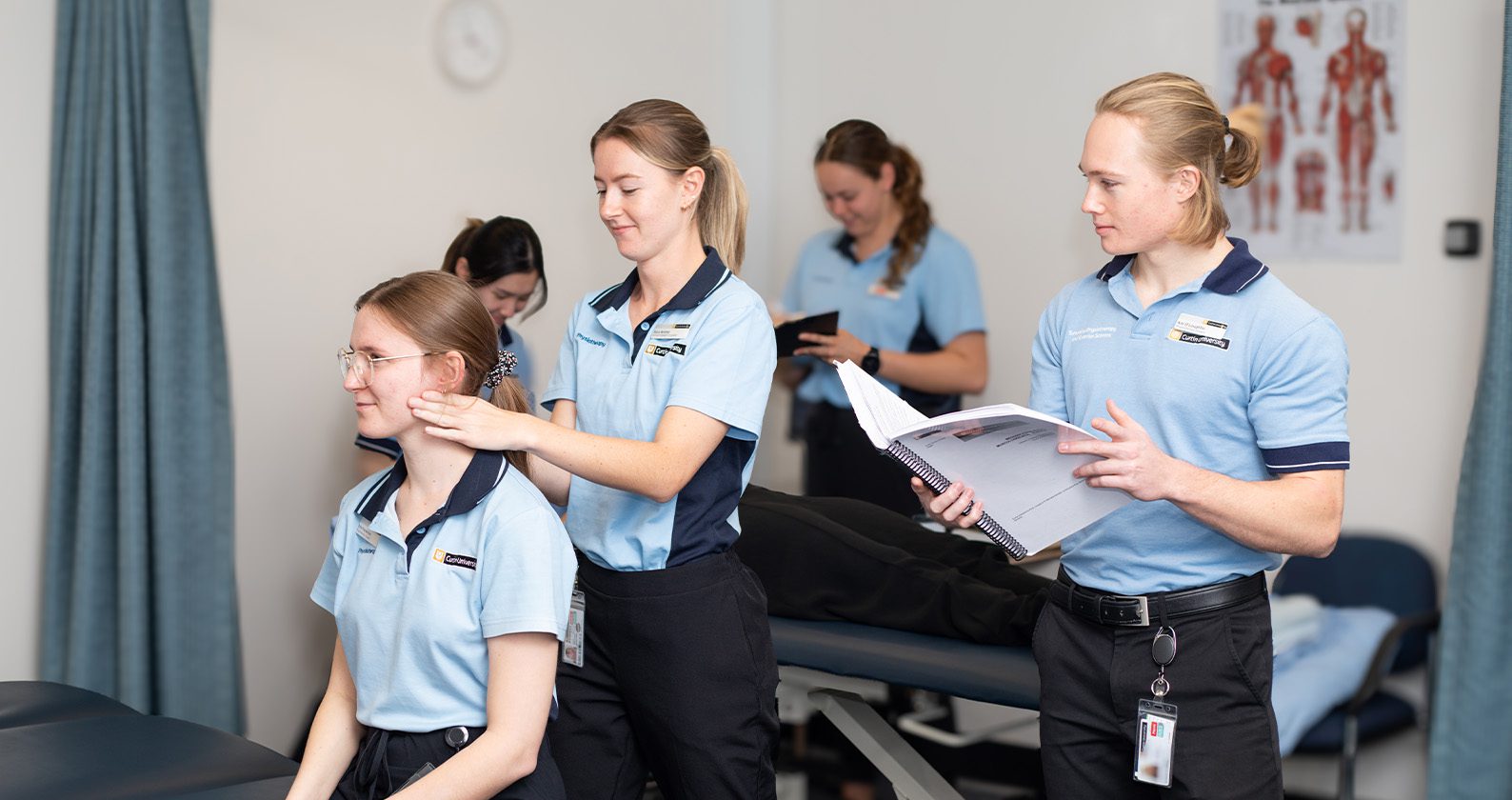 Physiotherapy students providing supervised treatment to a patient in a Curtin clinic.