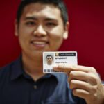 Student holding their Student ID