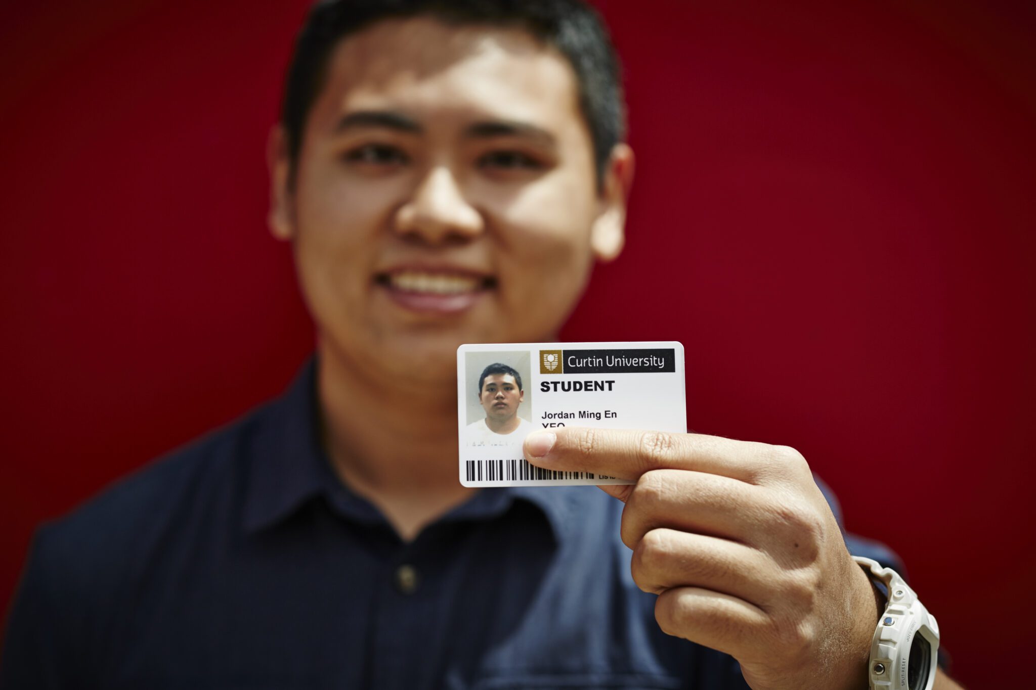 Student holding their Student ID