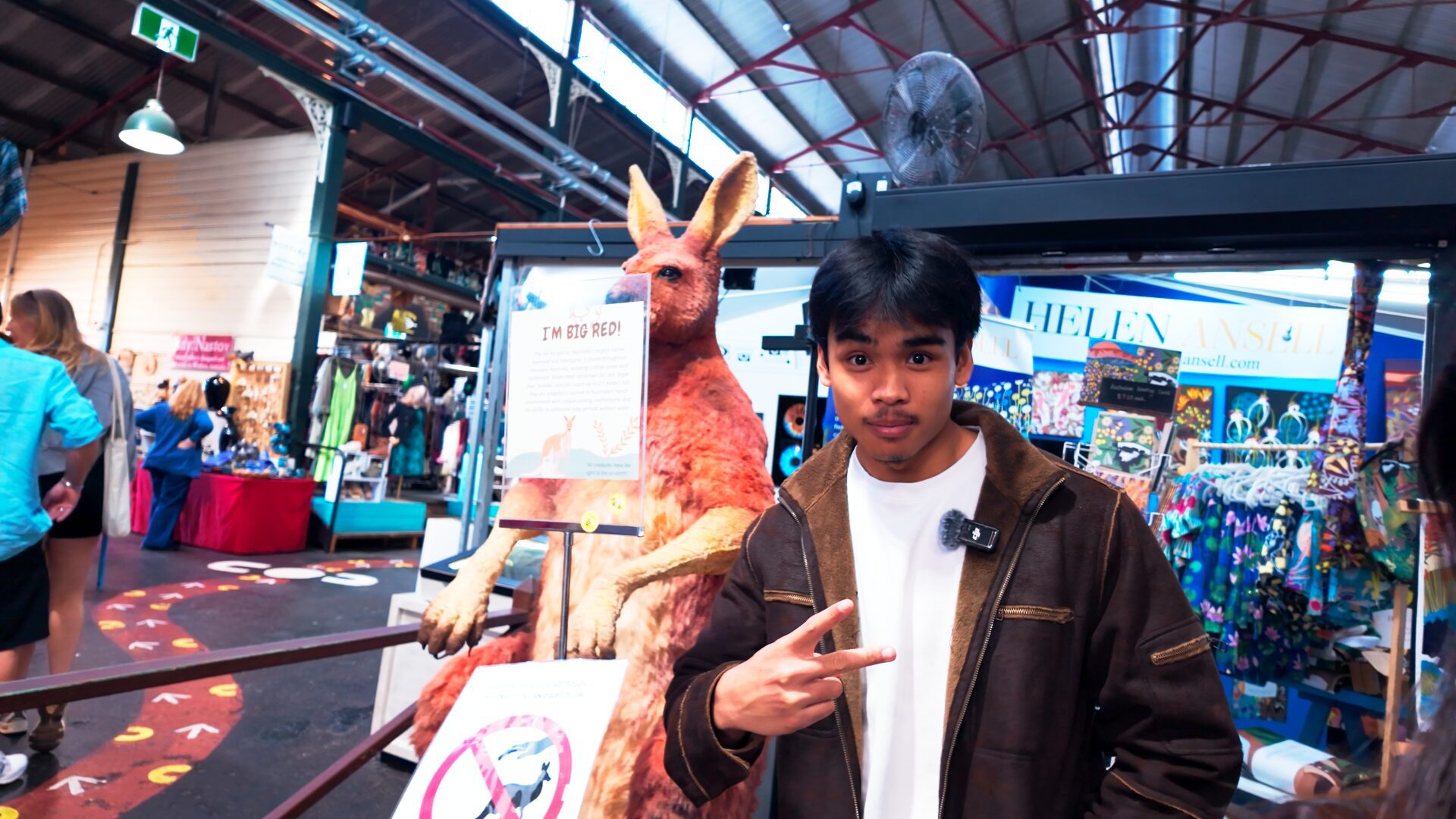 Musa standing in front of a taxidermied Kangaroo