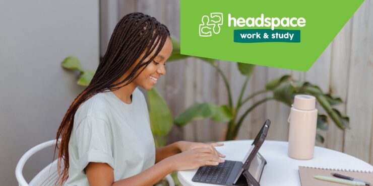 Person on laptop and headspace logo