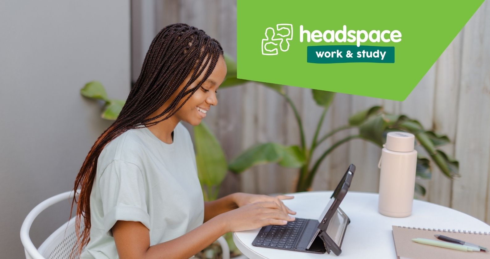 Person on laptop and headspace logo