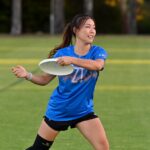 Student playing frisbee
