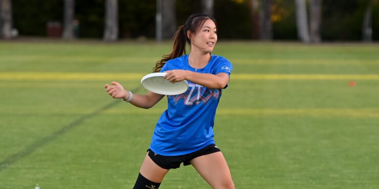 Student playing frisbee