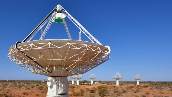 Radio dish in the outback with blue sky.