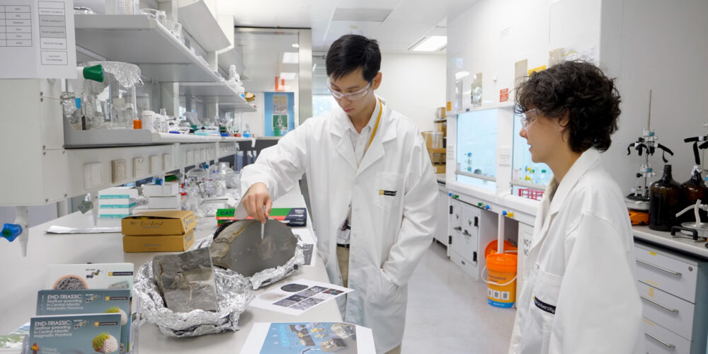 Researchers in the lab with fossil