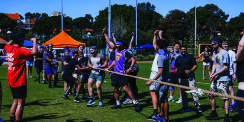 Students celebrate victory in a game of tug-of-war