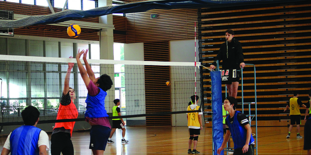 Students play a game of volleyball at Curtin Stadium