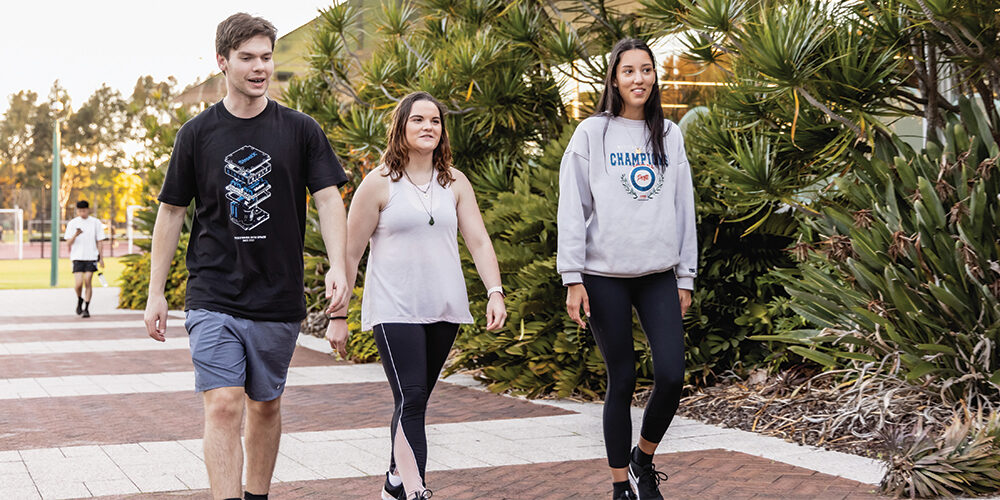 Students walking outside Curtin Stadium