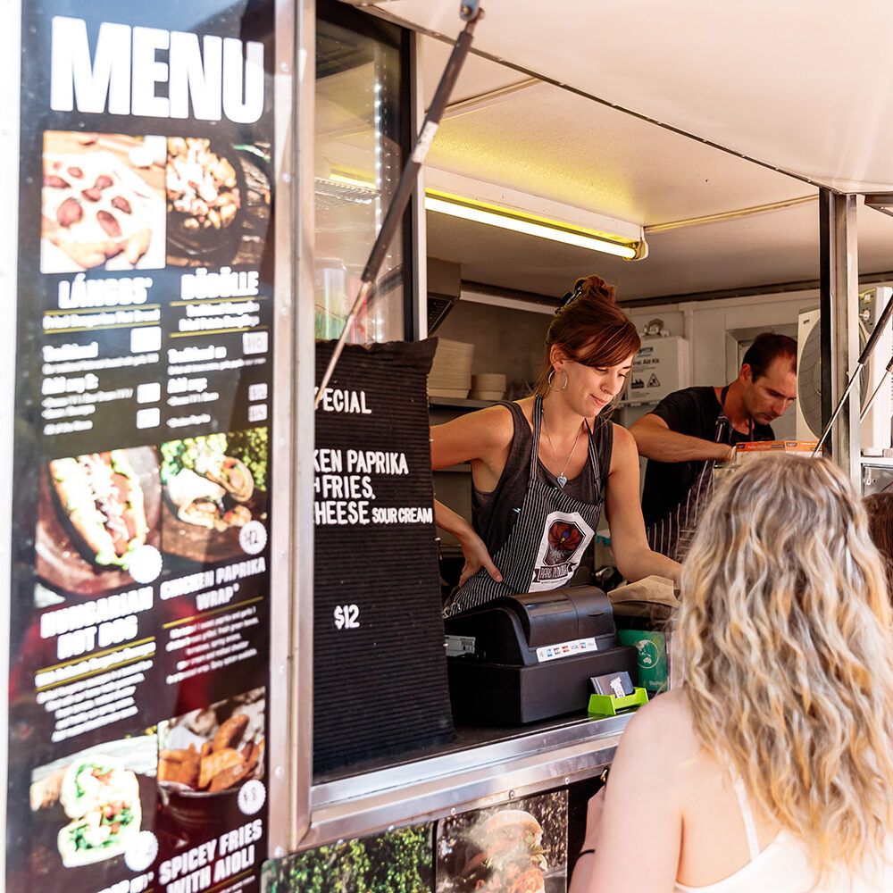 People ordering from a food truck