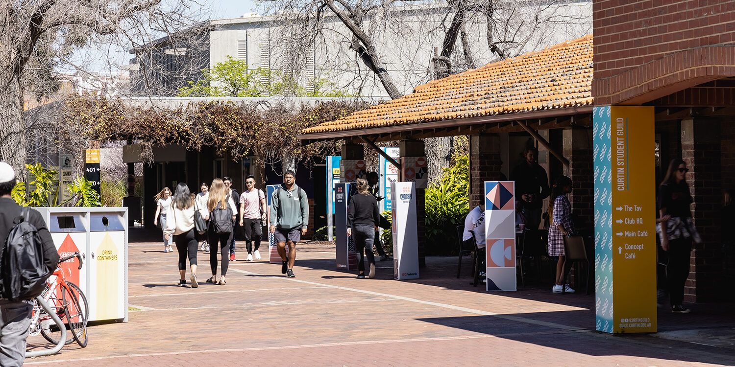 Photo of students walking through campus