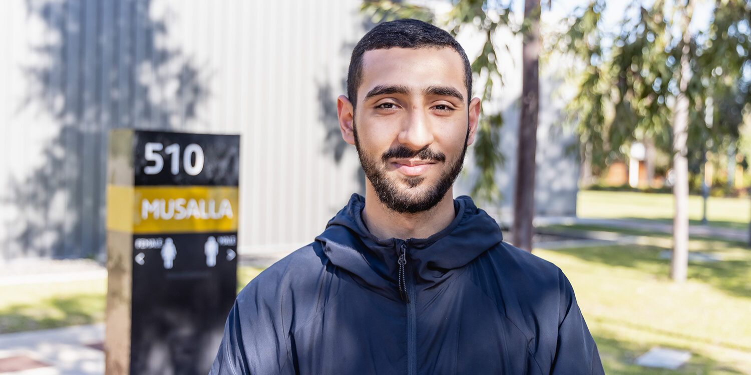 Person standing in front of Musalla at Curtin Perth