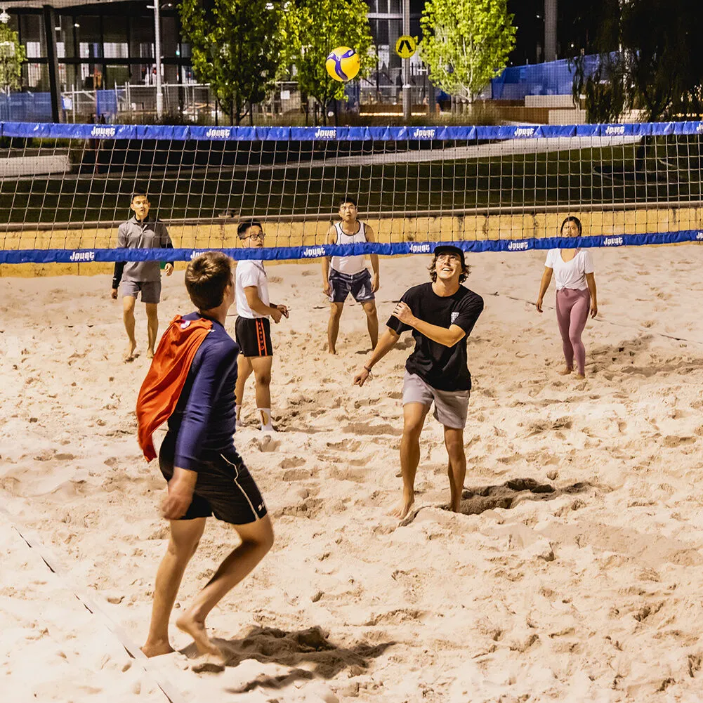 a group of students playing volleyball