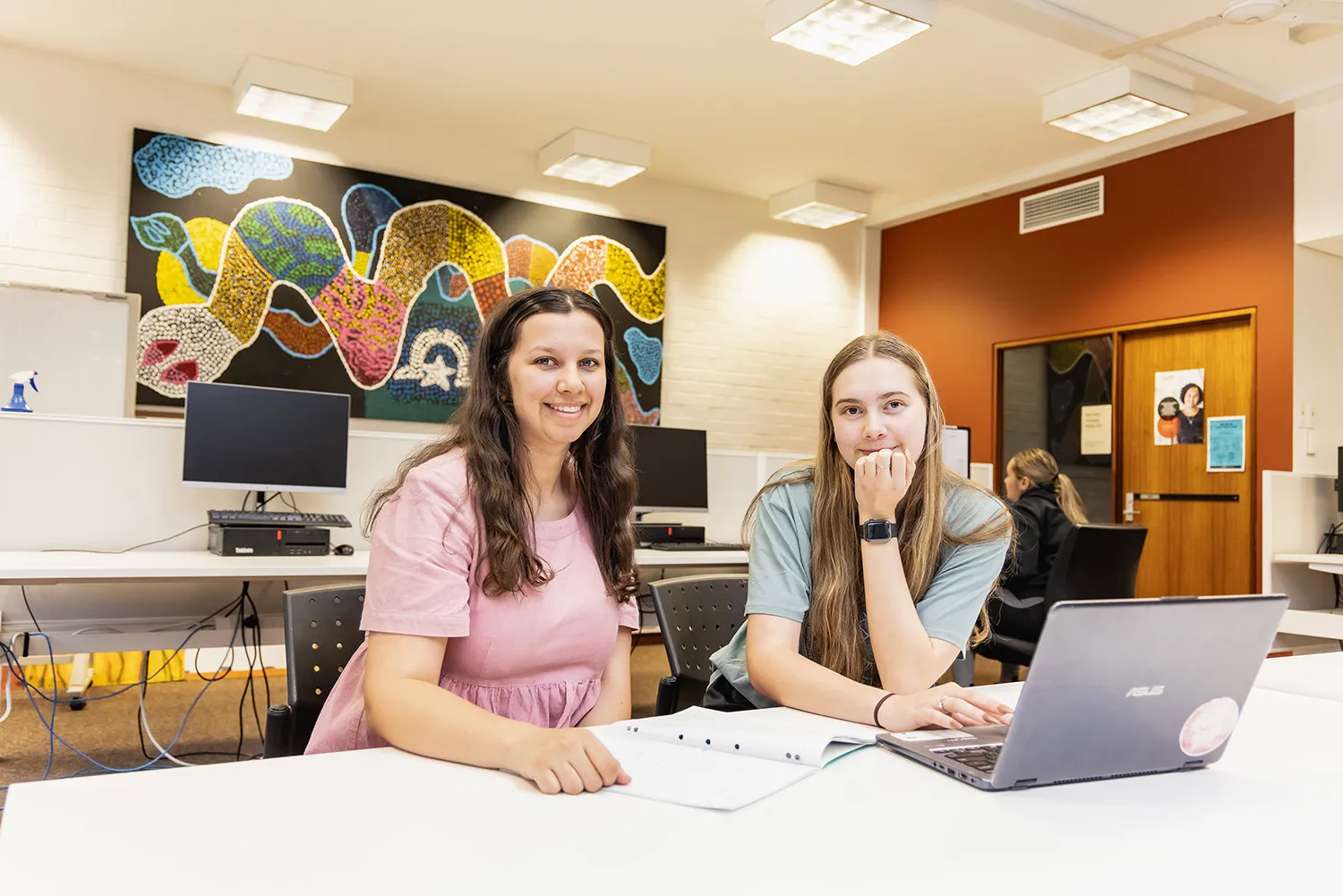 Two Indigenous students studying in the CAS computer labs