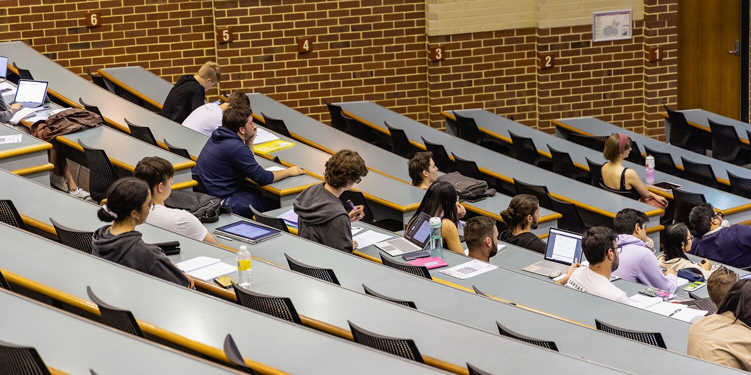 Students sitting in a lecture theatre