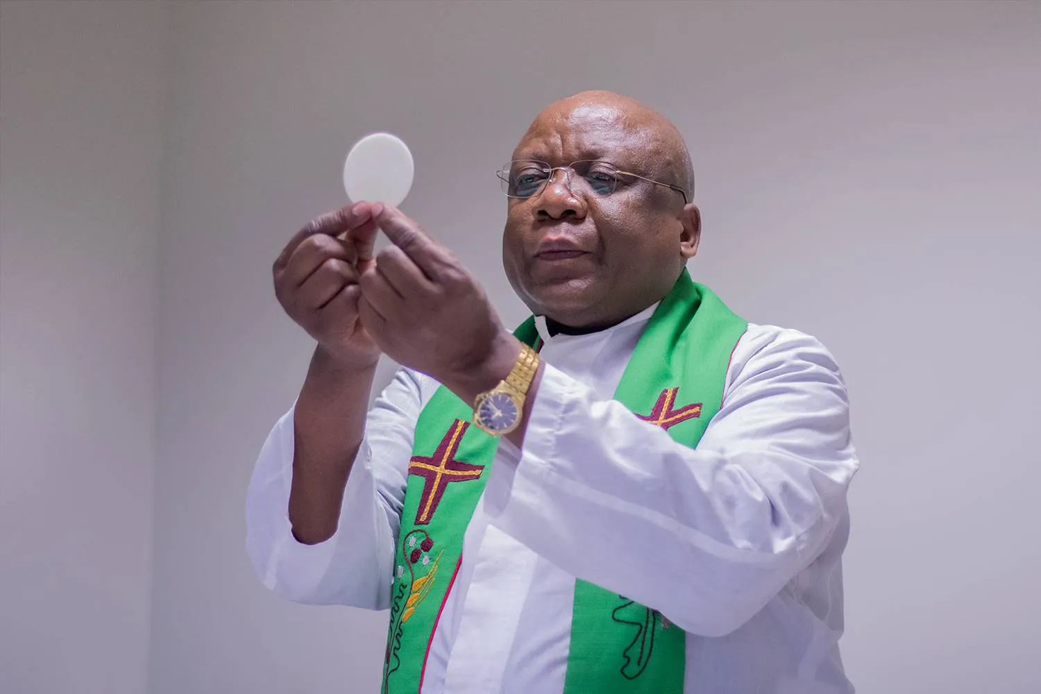 Catholic priest conducting Eucharist