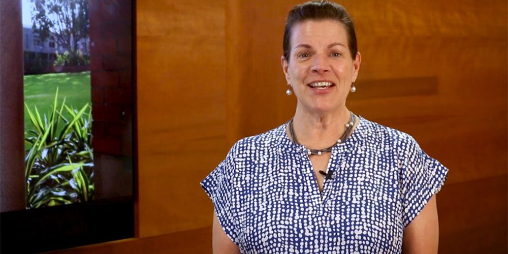 Vice Chancellor Harlene Hayne standing in an office on campus. - play video