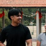 Image of Kristel and Musa talking and walking.