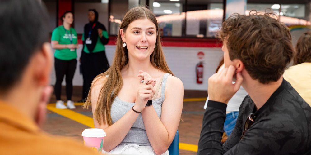 Two students talking to each other.