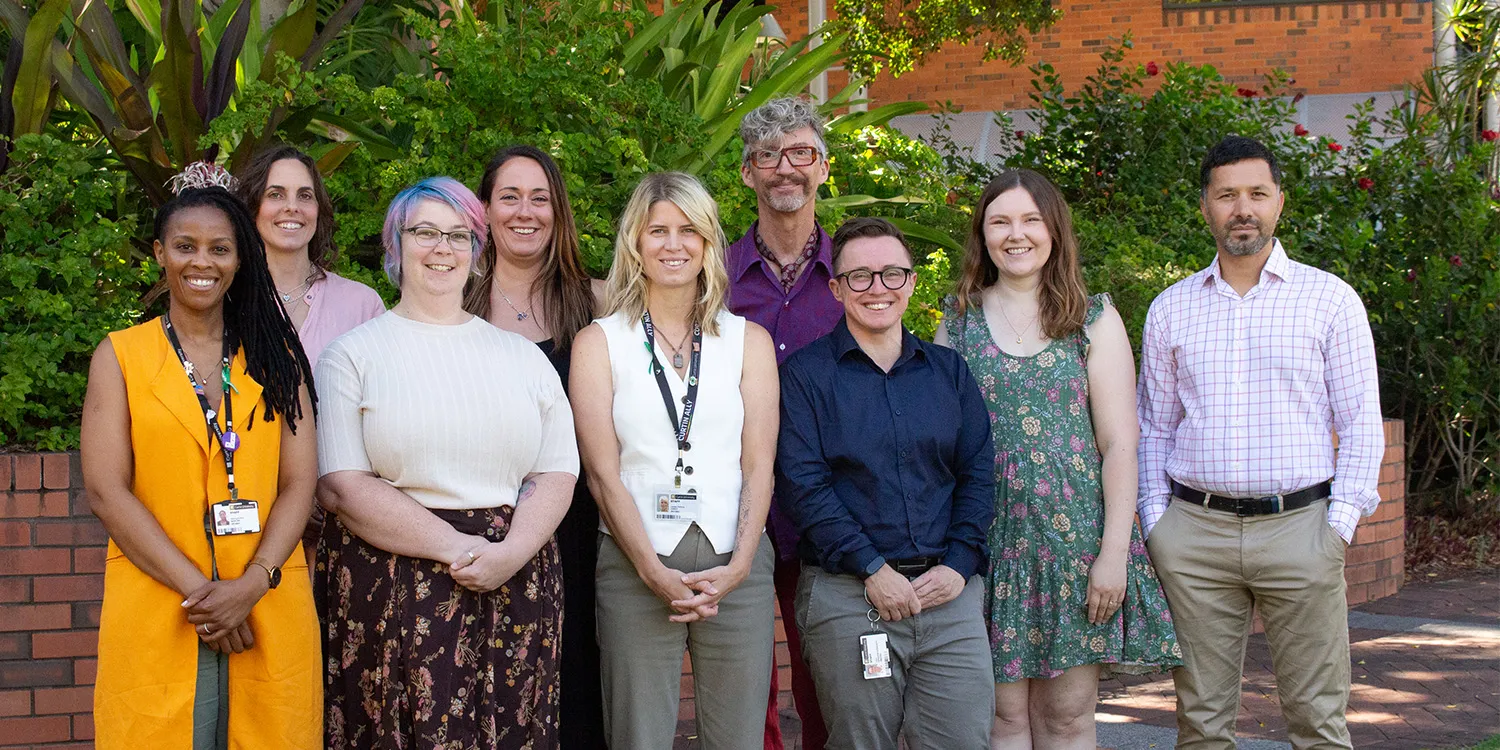 Group photo of the Wellbeing team - play video