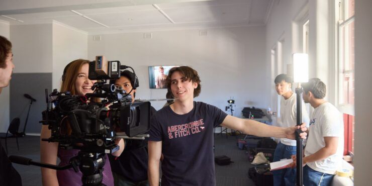 Humanities students using camera equipment
