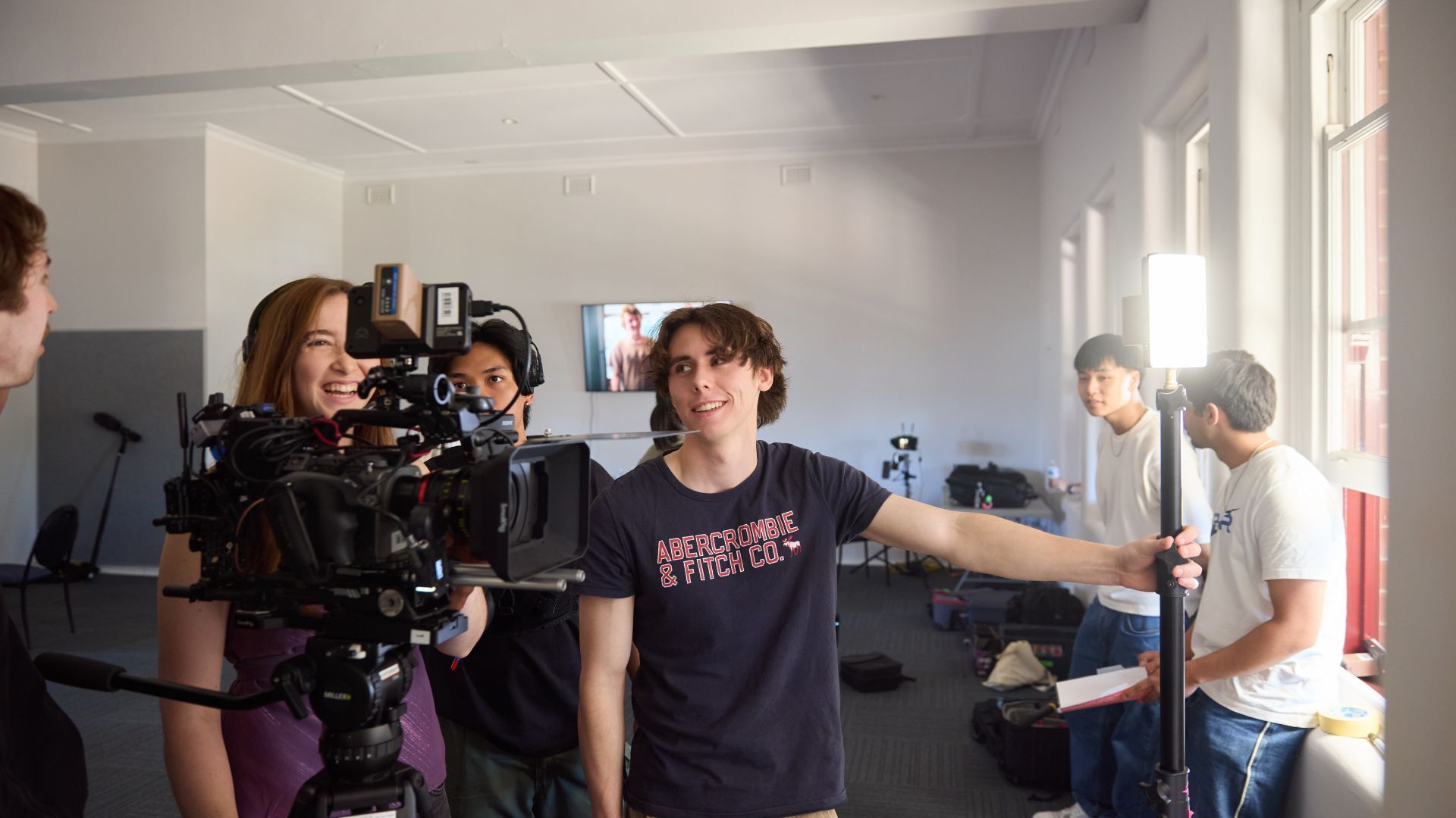 Humanities students using camera equipment