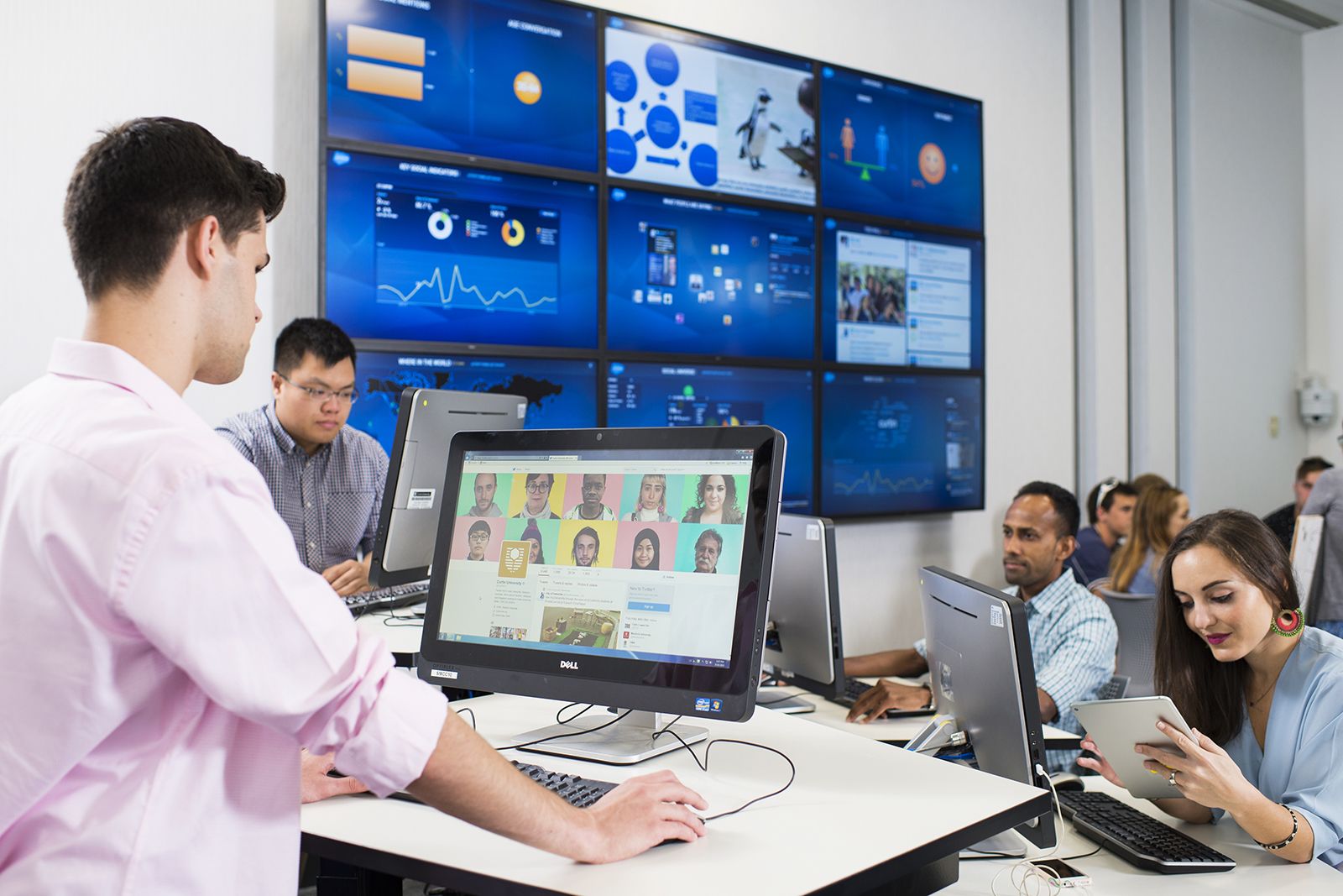 Group of students in the agency analysing social media