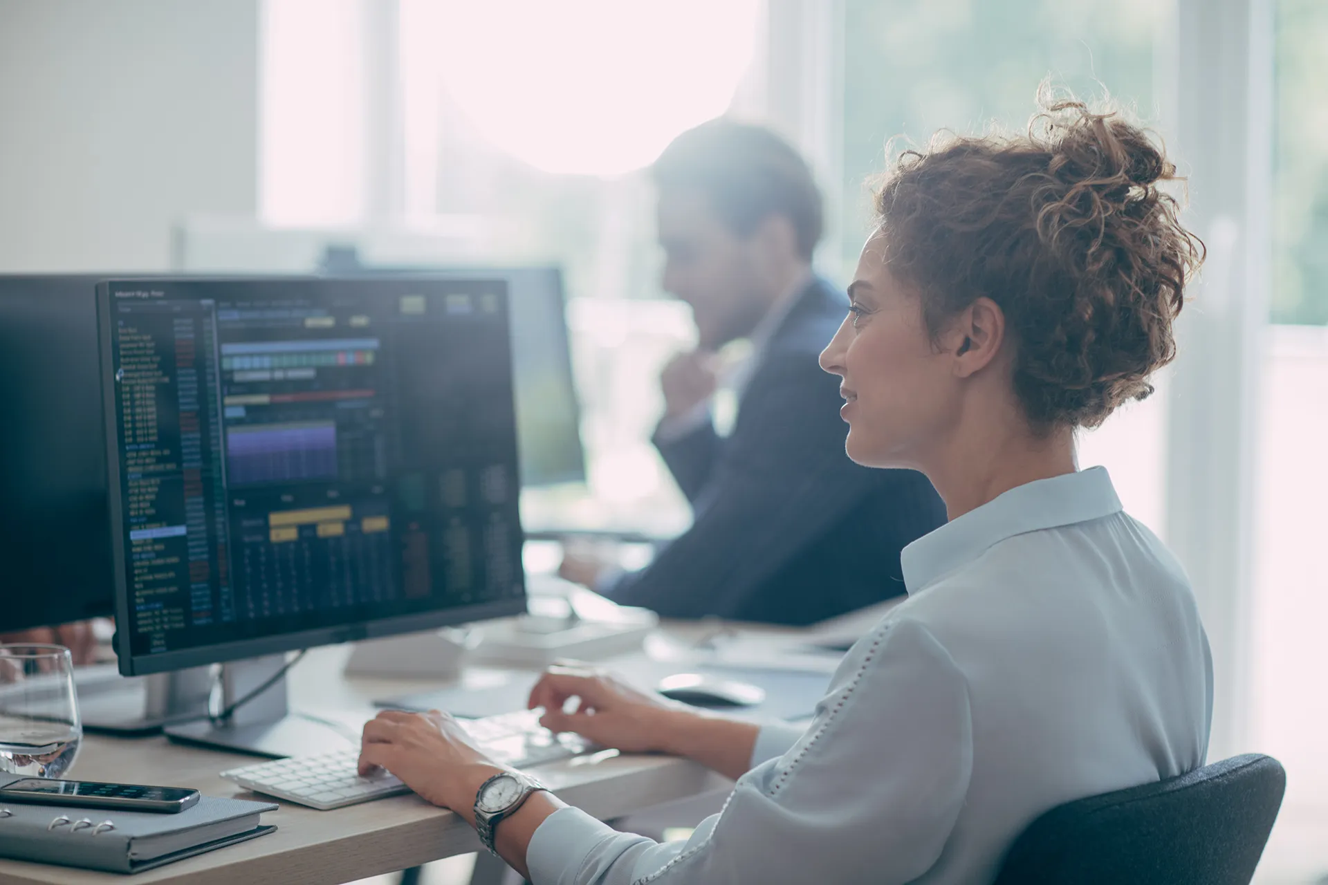 woman looking at stock trading software